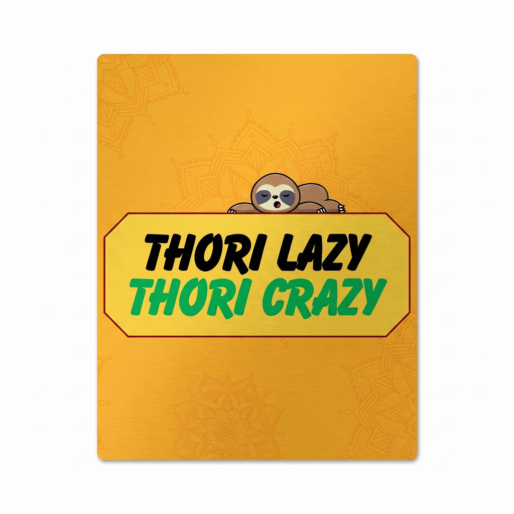 Close-up of Thori Lazy Thori Crazy poster showing a golden background with mandalas, a yellow badge, and a sleeping sloth.