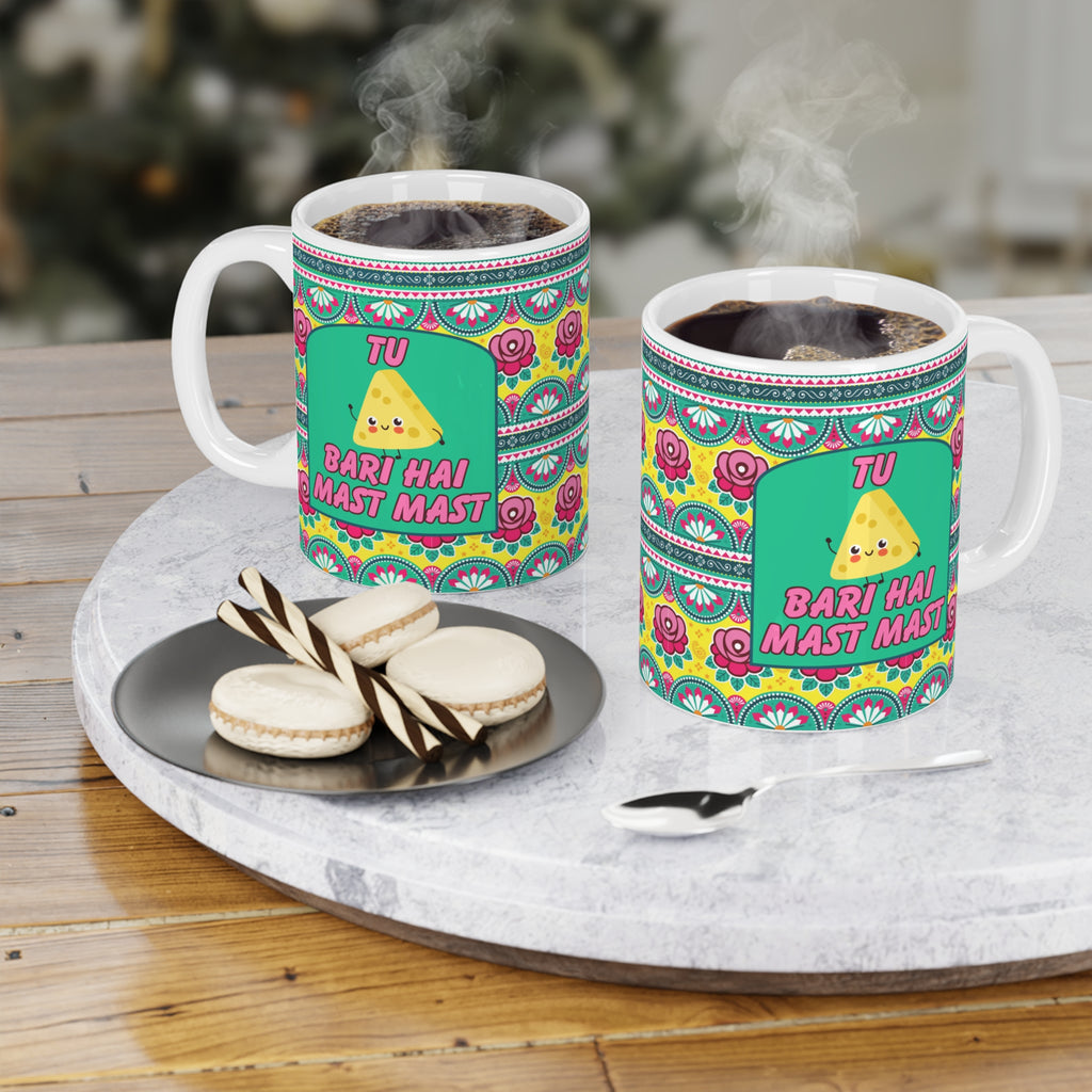 Tu Cheez Bari Hai Mast Mast ceramic mug 11oz with Bollywood-inspired design.
Perfect for tea and coffee lovers who enjoy fun desi quotes daily.
Durable ceramic with vibrant, scratch-resistant print for long-lasting use.
Microwave safe and dishwasher safe for reheating and easy cleaning.
Large comfortable handle makes chai or coffee sipping effortless.
A quirky and nostalgic gift for Bollywood fans, friends, or coworkers.
Adds music, fun, and cultural vibes to every tea or coffee break.