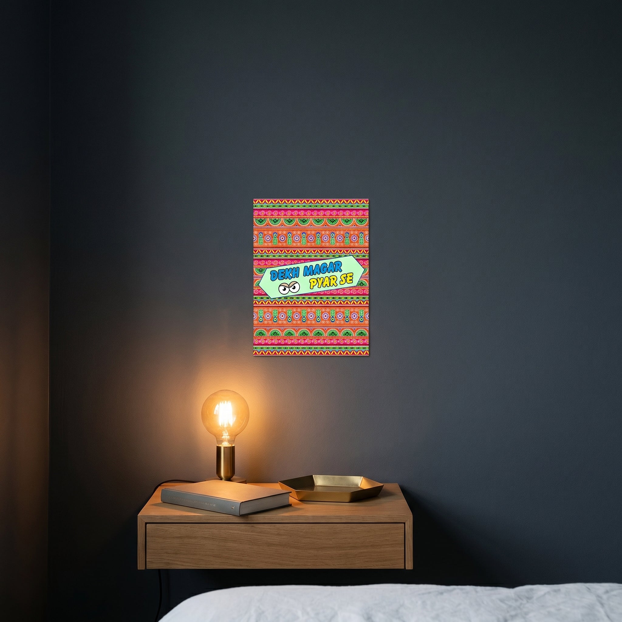 Humorous South Asian diaspora aluminum slogan sign styled on a dark grey accent wall over a modern wooden sideboard cabinet.