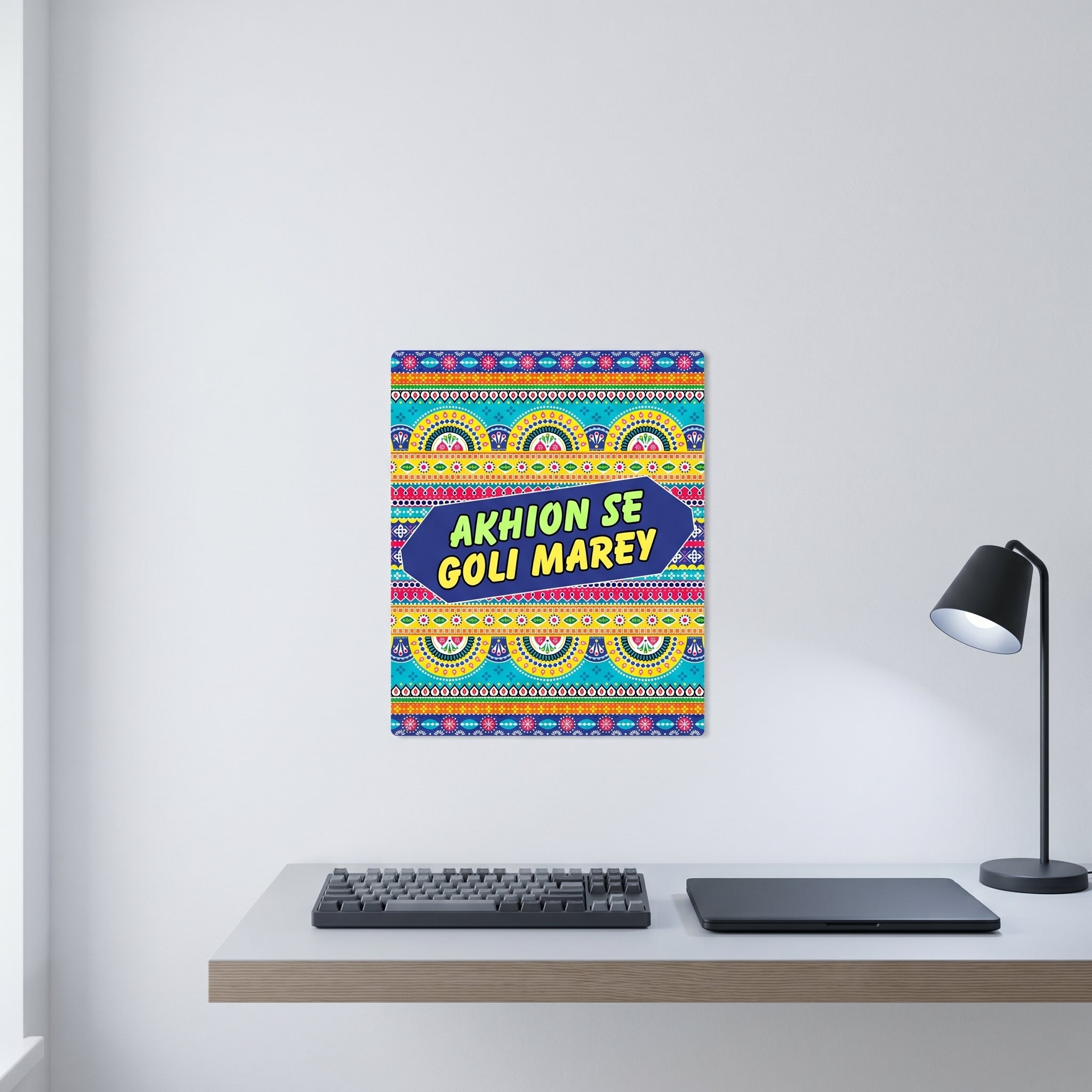 Traditional style South Asian retro pop art poster displayed on a white wall behind a minimalist home office desk setup.
