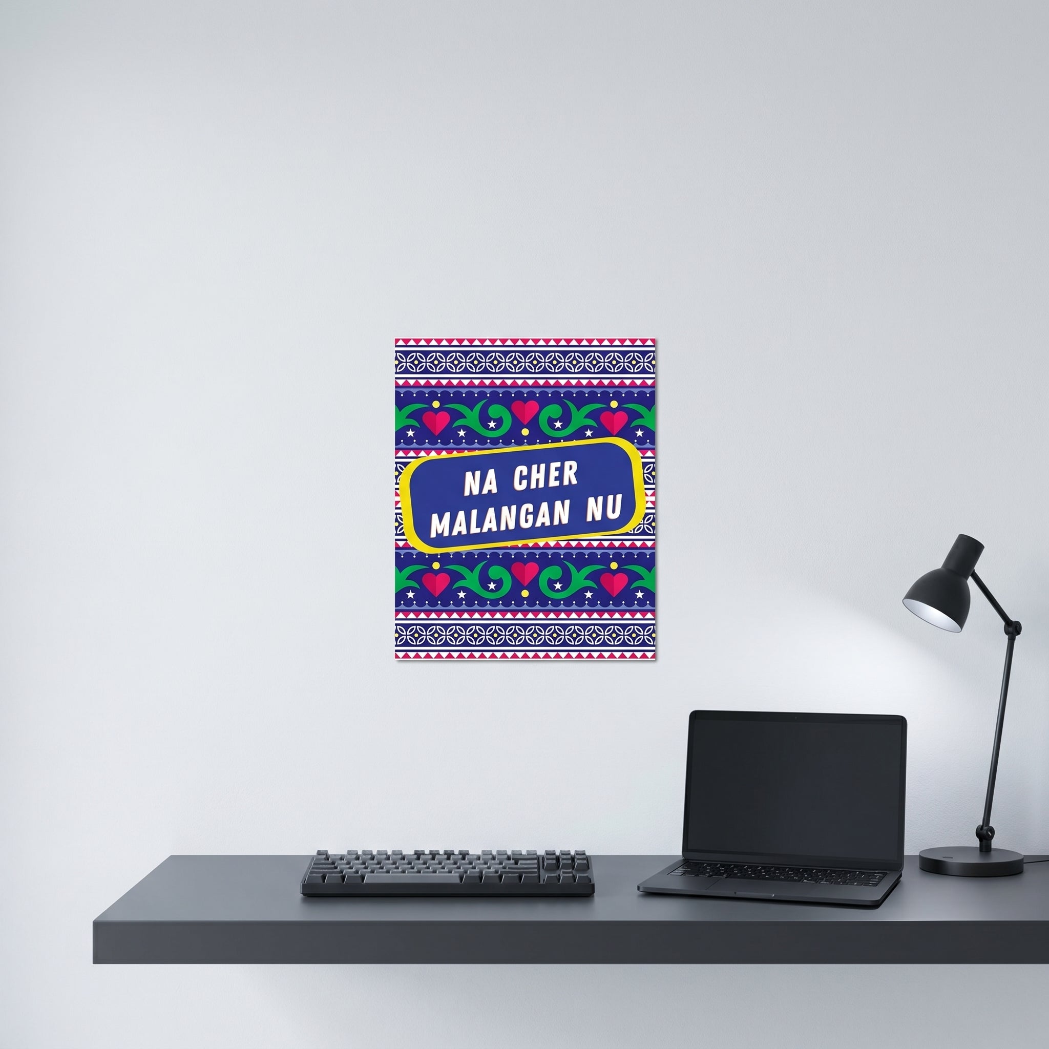 Vibrant South Asian culture poster hanging on a clean white wall behind a modern minimalist home office desk setup.
